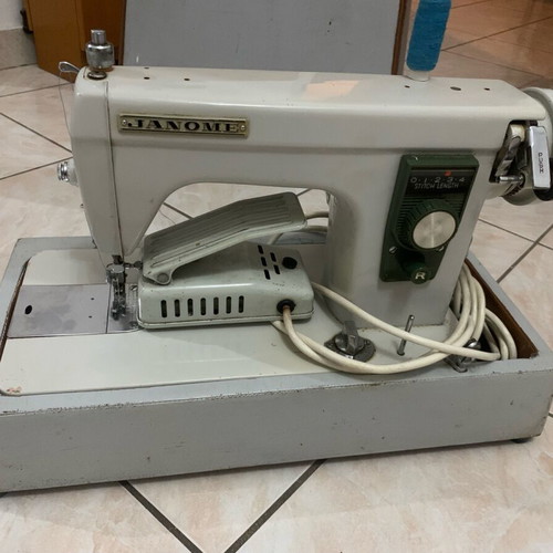 Electric collectible sewing machine used with carrying case