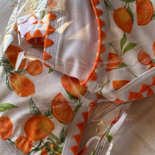 Women's swimsuit like new, white and orange with orange print, size M