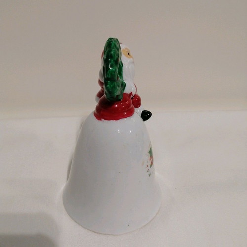 Ceramic bell like new with Santa Claus and wreath
