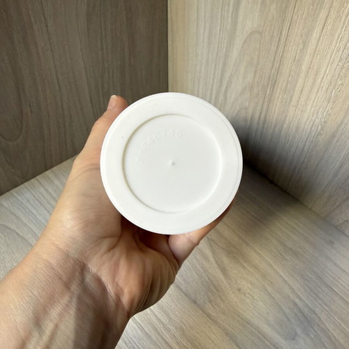 Reusable plastic coffee cup with screw lid