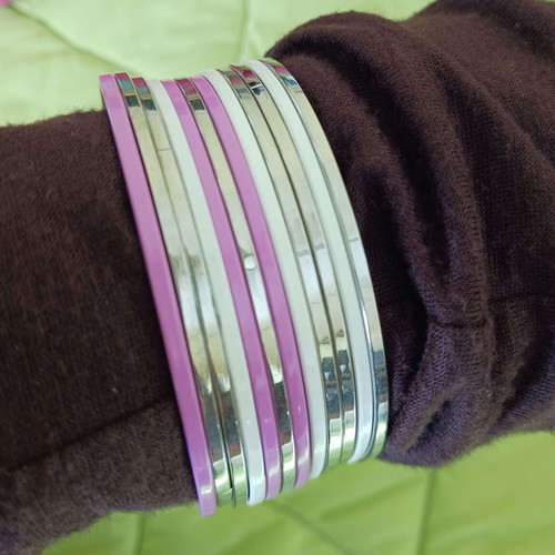 Set of 12 silver, white and pink steel bracelets like new
