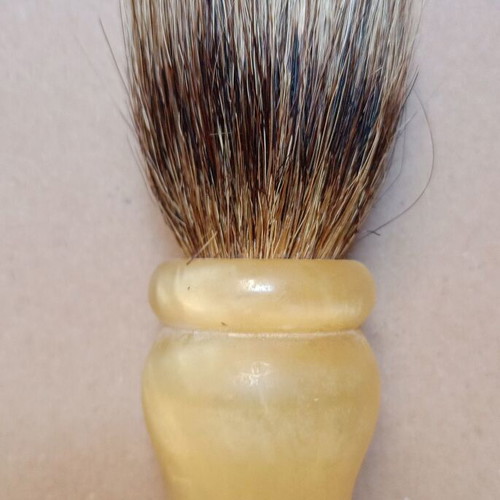Two shaving brushes, one says it is made in West Germany.