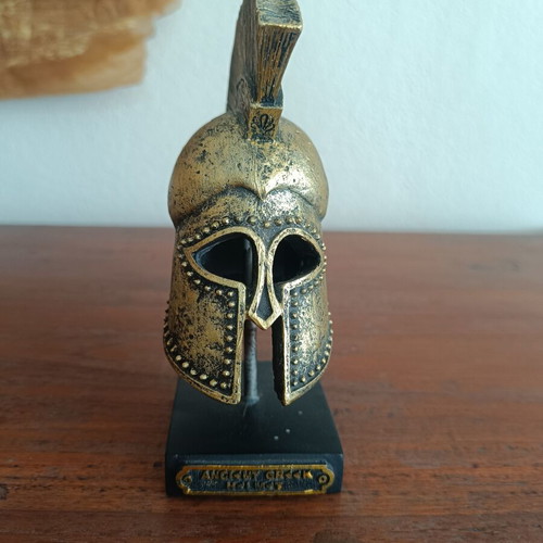 Decorative replica of ancient Greek Corinthian helmet used, bronze patina