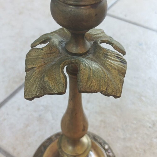 Metal candlestick used, gold color with brass finish