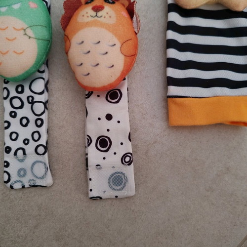 Set of socks and wrist rattles Lazarid Lion and Dinosaur new