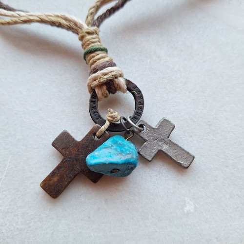 Necklace like new with woven cords, wooden cross, metal cross, and turquoise stone