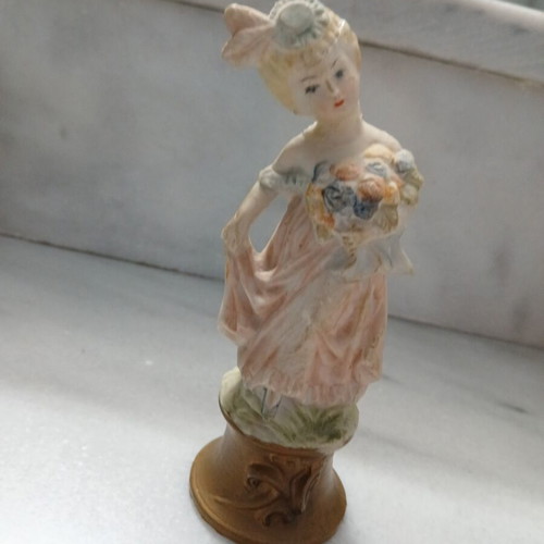 Vintage decorative figurine small lady with atmospheric details