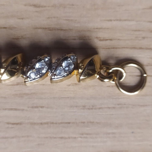 Swarovski bracelet like new, gold tone with crystals