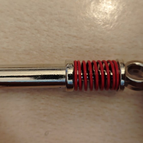 Shock absorber keychain, red