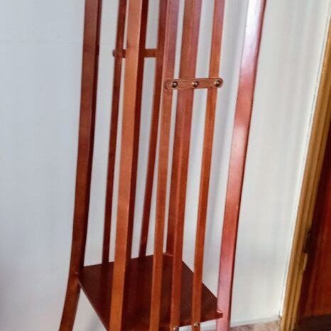 Handcrafted tall wooden plant stand with carved floral details