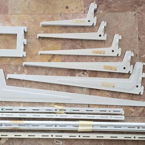 Wall shelf system used, metal brackets and wall uprights
