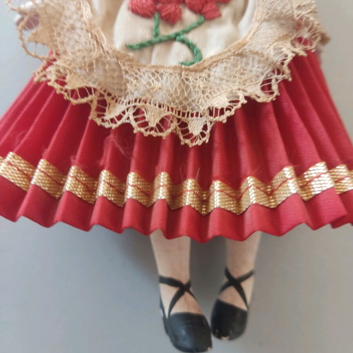 Vintage doll used with porcelain head and embroidered apron