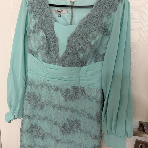Long turquoise dress with lace embroidery and satin details