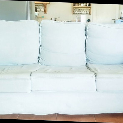 Sofa like new with removable washable fabric and extra armrest covers
