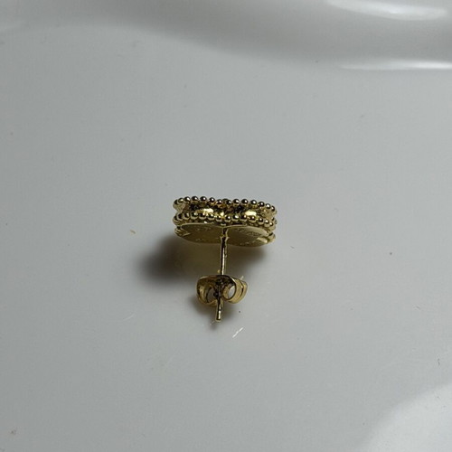 Steel earring black and gold, like new, single piece
