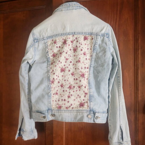 Denim jacket refurbished with upcycled design