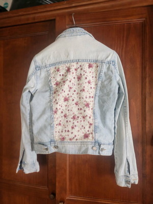 Denim jacket refurbished with upcycled design