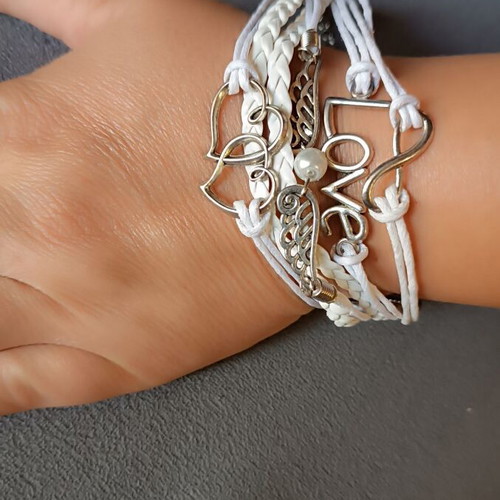 Love bracelet set new with white cords and charms