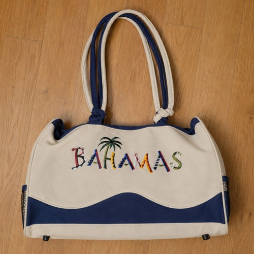 Beige fabric beach bag with colorful embroidered Bahamas lettering