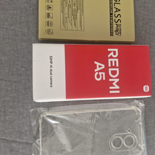 Redmi A5 64GB Sandy Gold smartphone with bonus glass protectors and case