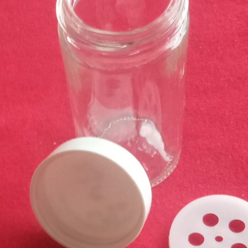 Spice jars used in wooden rotating rack with 16 glass containers