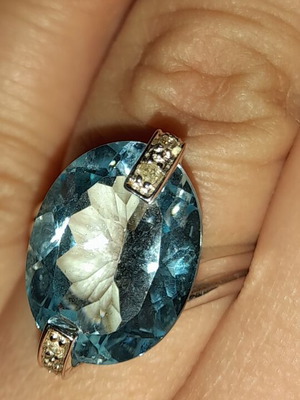White gold ring with large aqua marina and zirconia