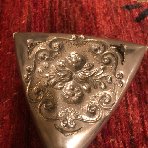 Decorative triangular vessel used with embossed flowers