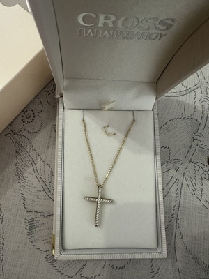 Gold cross 14 carat with long 9 carat chain, like new