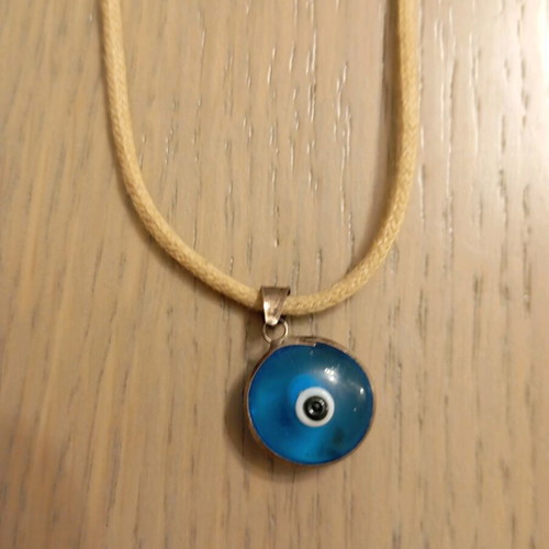 Evil eye pendant with adjustable strap like new