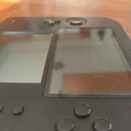 Nintendo 2DS used with stylus and charger