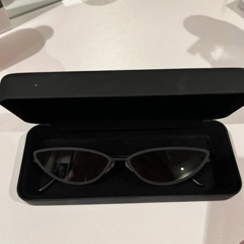 Sunglasses new with thin black frame and pink lens