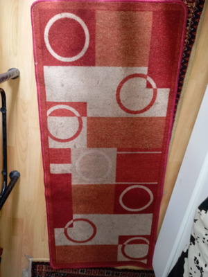 Vintage carpet runner used with geometric motifs in warm colors