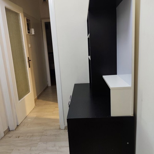 Bookcase used, black color with shelves and drawer