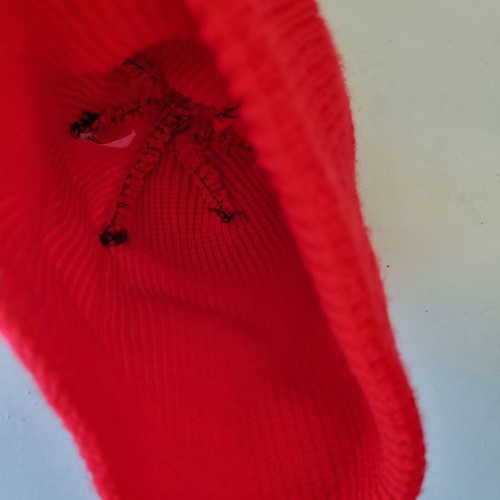 Knitted hat in bright red