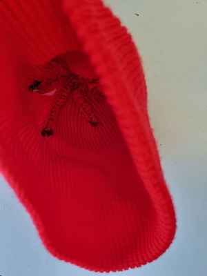 Knitted hat in bright red