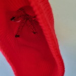 Knitted hat in bright red