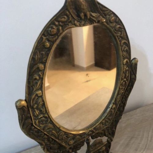 Set of two brass mirrors, table and hand used