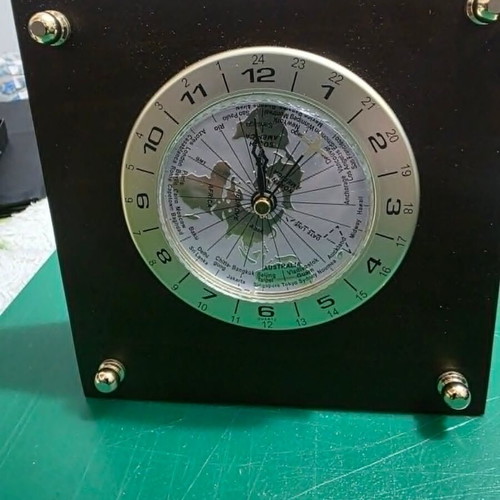 Luxury analog desk clock with world map and airplane needle