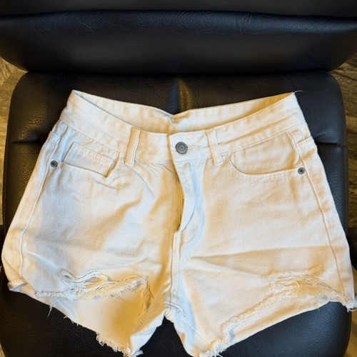 White denim shorts used, size small with distressed details