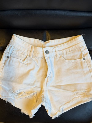 White denim shorts used, size small with distressed details