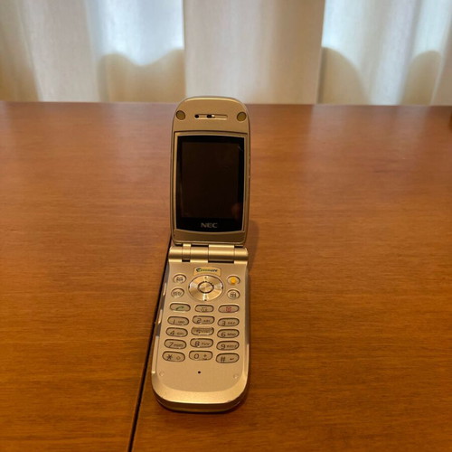NEC 410i mobile phone used with charger and handsfree