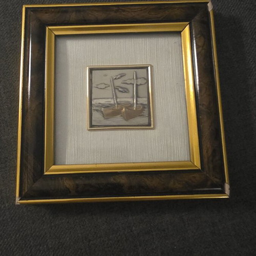 Decorative frame with embossed metal artwork used, made in Italy
