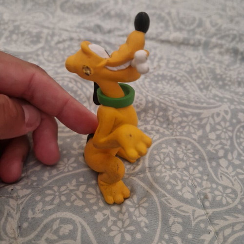 Pluto figure used with one broken ear