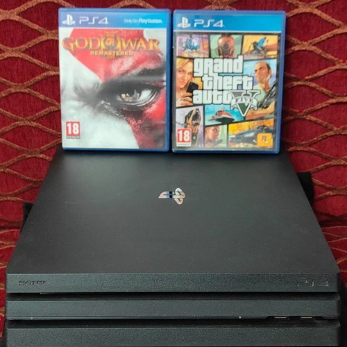 PlayStation 4 Pro 1TB like new with controller and 2 games