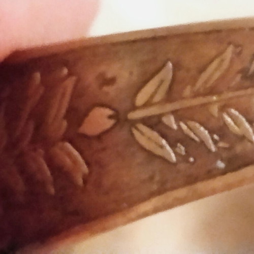 Vintage copper cuff bracelet with Greek neoclassical motifs, used