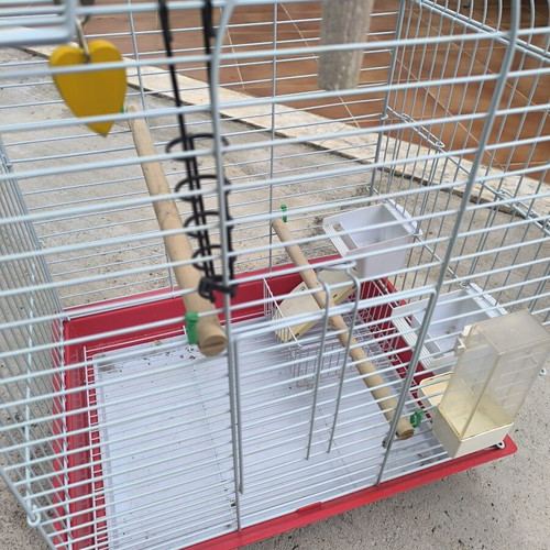Metal birdcage like new with perches and feeders
