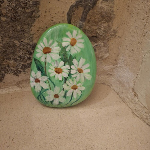 Handmade porcelain paperweight with daisies