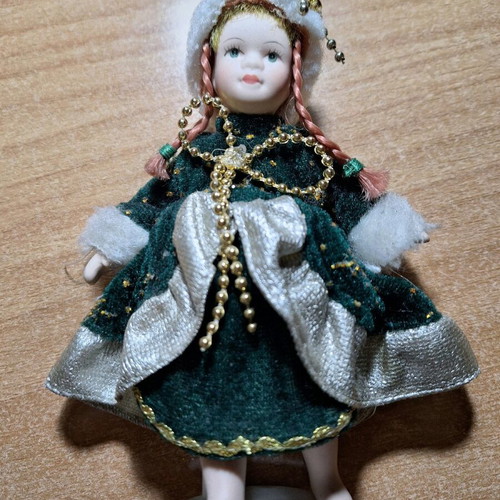 Porcelain doll on stand like new