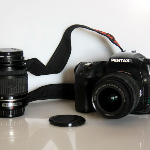 Pentax K10 DSLR camera used with lenses and case