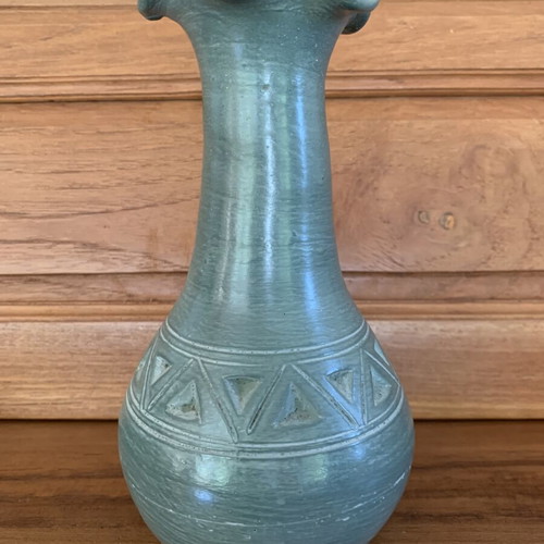 Handmade ceramic vase with carved geometric patterns, like new